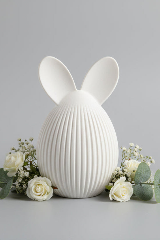 Egg with rabbit ears in white